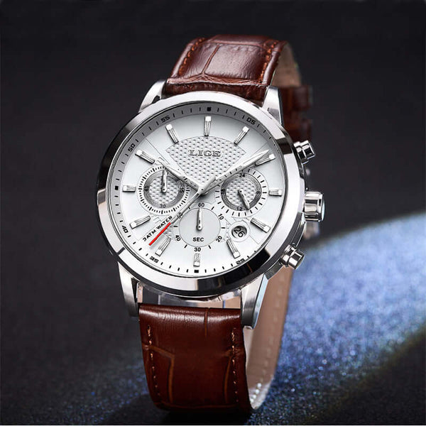 Men's fashion quartz watch with brown leather strap and white dial, featuring chronograph function and sleek design.