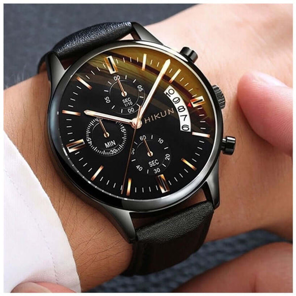 Black alloy quartz wristwatch on male wrist with multi-function dial and leather strap, perfect for casual wear.